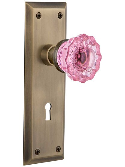New York Mortise Lock Set with Colored Fluted Crystal Glass Knobs Pink in Antique Brass.